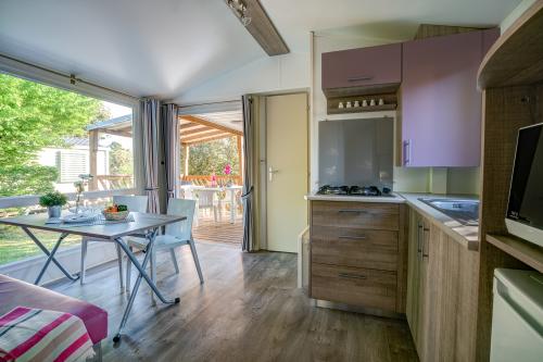 Camping Sandaya Les Peneyrals - Cottage 2 bedrooms ** - Photo 4
