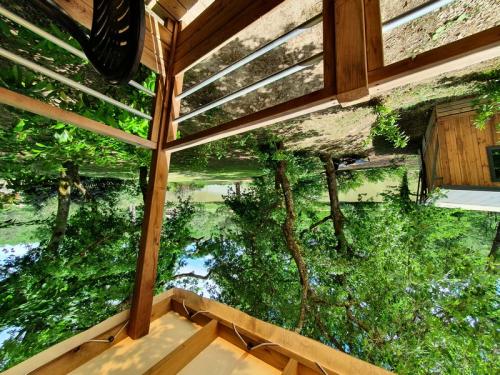 Sites et Paysages Domaine de l'Etang de Bazange - Cottage Premium Lodge Vue etang, TV, clim, terrasse couverte - Photo 1